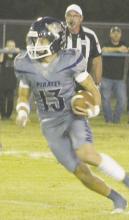 Cole Keeney looks for running room during the Pirates’ loss Friday, Oct. 4 to Saint Jo. Photo/Brian Smith
