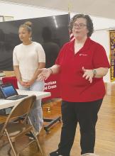 Cornerstone Community Action Agency’s Amanda Sanchez, right, and Skylar Fergurson speak to Jacksboro Lions Club members about their organization during the Wednesday, Sept. 25 meeting. Photo/Brian Smith