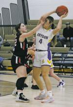 Riley Valliant (4) is fouled by a defender during a recent game. Valliant and her Cowgirl teammates won their District 21-A opener, 39-38, over Newcastle last Tuesday. Photo/Brian Smith
