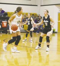 Perrin senior Aaliyah Brown looks to get past the Archer City defender during a Gordon Tournament game Tuesday, Dec. 27. Brown had 13 points in the 39-30 loss. Photo/Brian Smith