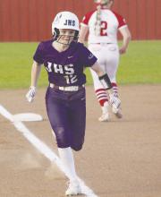 Holly Lehman comes home from third base with the first run of the Tuesday, March 5 game for the Tigerettes. Photo/Brian Smith