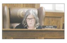 Jack County Precinct 2 Commissioner Amy Salazar looks over her notes during the Monday, March 24 meeting. Photo/Brian Smith