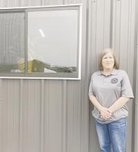 New Jack County Precinct 2 Commissioner Amy Salazar is seen with the plant in her window. The plant comes from her husband Kenny’s funeral and is a reminder of what he wanted to accomplish. Photo/Brian Smith