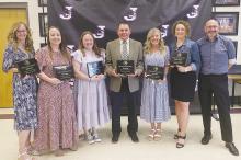 Shown from left to right Jacksboro ISD educators Kathleen Rae, Denisa Moye, Jennifer Conner, Donny Gray, Christi Rater, Caroline Vaughn and Brandon Carpenter who all received Teacher Incentive Allotment awards during a ceremony Tuesday, May 14. Photo/Brian Smith