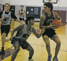 Junior Cannon Valenzuela looks to muscle his way inside during a Poolville Summer League basketball game with Henrietta June 13. Valenzuela had 21 points to lead the Tigers in a 55-46 win over their District 7-3A rivals. Photo/Brian Smith