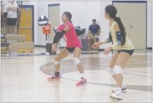 Perrin senior Erika Hernandez (1) returns a serve with classmate Priscilla Salazar ready to assist Thursday, Sept. 21 as the Lady Pirates faced Christ Academy. Photo/Brian Smith