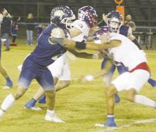 Cameron Tune blocks a Knox City defender during the Thursday, Oct. 31 game. Perrin had a pair of defensive stops late to post a 48-42 victory. Photo/Brian Smith