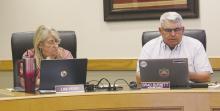 Jacksboro ISD Superintendent Brad Burnett, right, gives his monthly report while board secretary Lisa Perry listens during the Monday, April 14 meeting. Burnett discussed bond issue construction. Photo/Brian Smith