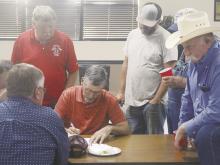 Darren Francis, center, and his group discuss what they would like to see if a bond issue is proposed by Perrin-Whitt CISD. An informational meeting was held to gather ideas Wednesday, Oct. 9. Photo/Brian Smith