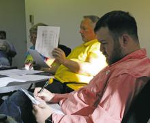 Bryson City Council member Jesse Laine looks over the working 20242025 budget for the city during the Tuesday, Aug. 27 meeting. Photo/Kylie Bailey
