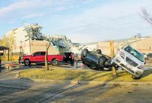 Cars are toppled and Jacksboro Elementary School took a hit from the tornado that ravaged the town March 21, 2022. Recovery has begun, but city and county officials admit there is still a lot to do. File photo