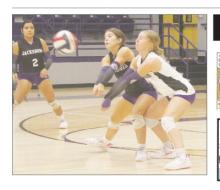 Lileigh Taylor (0) and Rylee Bennett nearly collide going for the ball during the Tigerettes match Friday, Oct. 25 against Henrietta.