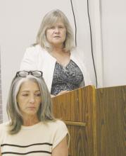 Tina Henson with Garver Engineering, at the podium, speaks to Jacksboro council members on the updated city’s water conservation plan at the Monday, April 28 council meeting. The Texas Commission on Environmental Quality requires cities have a plan and update it every five years. Photo/Brian Smith