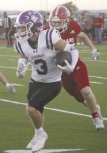 Jacksboro senior Evan Walker looks for running room after his first reception of the night in the 42-40 loss Friday, Sept. 20 to Jim Ned. Walker had two receptions for 13 yards. Photo/Brian Smith