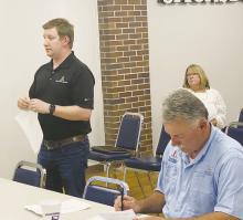 Public Management Project Manager Dalton Aiken, left, gives an update on the downtown grant while City Manager Mike Smith listens. Photo/Brian Smith