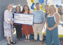 Affirming Texas Families Services, which serves Jack County, received a check from Bowie Walmart during an Aug. 4 grand opening. The monies will be used to provide free counseling services to victims of crime and non-offending family members. Board members, including JHS Counselor Dori Taylor, far right, accepted the check. Courtesy photo