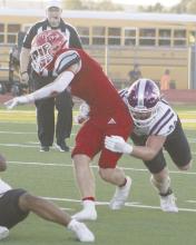 Will Treadway makes the tackle on a Jim Ned player, during the Tigers’ Friday, Sept. 27 win. Jacksboro went to 4-1 overall with a 71-2 win over Burkburnett. No stats available as of press time. Photo/Brian Smith