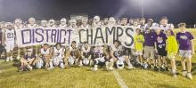 Jacksboro’s varsity football team and supporters pose with its District 5-3A Division II sign after its 24-17 win Thursday, Oct. 26 over Millsap. The Tigers, ranked No. 10 in the state, will host Dublin at 7 p.m. Friday, Nov. 3 and will try to wrap-up a perfect 10-0 regular season in the process. Courtesy photo