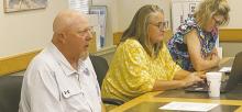 Jacksboro ISD Child Nutrition Director Craig Adkins, left, gives an annual report on his department Monday, July 8. Photo/Brian Smith