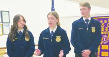 Allie Robinson, center, makes a point in favor of new electric style farm equipment, while teammates Paisley Jewell and Eli Jonas listen at the Jacksboro Lions Club meeting Wednesday, Oct. 23. Photo/Brian Smith