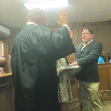 Charles “T-Bob” Hauger, Jr., right, takes his oath of office during a ceremony Monday, July 15. Hauger was sworn in as interim Jack County Sheriff by Jack County Judge Keith Umphress.