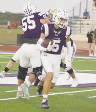Jacksboro senior Eric Pizana looks for running room during the Tigers’ home opener Friday, Sept. 6 against Boyd. Jacksboro fell behind early but scored on nine straight possessions to overtake the Yellowjackets and post a 67-22 win. For more details, see page 8. Photo/Brian Smith