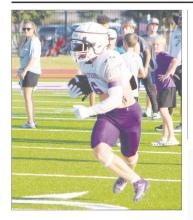 Luke Sams (6) looks for running room during the Tigers’ scrimmage Friday, Aug. 16 against Muenster. Jacksboro has its final scrimmage Thursday, Aug. 22 at Tolar.