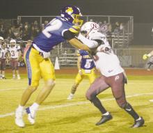 Maurice Reiter blocks the Northside defender during first half action of the Cowboys’ win over the Indians. Photo/Brian Smith