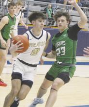 Perrin’s Jack McCormick drives inside during the regional semifinal match-up Thursday, Feb. 27 with May. Photo/Brian Smith
