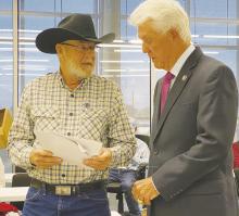 Congressman Roger Williams, right, speaks to a constituent during his Town Hall Meeting Oct. 11. Williams, who will represent Jack County in Congress beginning in January, spoke of what he will continue to do in Washington. Photo/Brian Smith