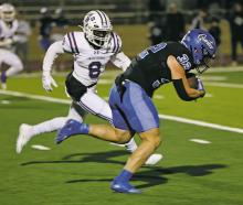 Jacksboro Tiger junior Kaleem Howard (8) looks to put the defensive hit on Gunter running back Ashton Bennett during the Thursday, Nov. 17 area round game in Grapevine. Jacksboro saw their season end at 8-4 with a 48-7 loss to the Tigers. Courtesy photo