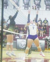Jacksboro senior Chloe Hart (7) sets the ball while an Alvord defender tries for the block during the Poolville Tourney. Photo/Brian Smith