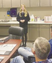 Bryson junior Braydee Thorne speaks to the Bryson ISD board of trustees, including Ronnie Collins and Travis Thorne, about her speech, which she will present at the state FFA speech competition in mid-July. Photo/Brian Smith