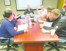 Bryson ISD Superintendent Greg London, back right, explains a portion of the agenda during the Monday, Dec. 18 meeting. Photo/Brian Smith