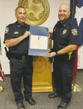 Jacksboro Police Department Chief Bryan Corb and JPD Detective Aaron Austin receive a law enforcement training certification Friday, June 7 from the Texas Commission on Law Enforcement in Austin. Contributed photo