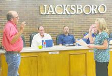 John Moffit (left) is sworn in, by Jacksboro City Secretary Shalyn Burritt, as the Place 5 alderman spot, replacing Stewart Chalmers, during the Monday, July 8 city council meeting. Photo/Brian Smith