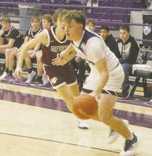 Wyatt Gavit gets past the Bowie defender during the District 7-3A opener for both schools won by the Tigers, 46-44. Photo/Brian Smith