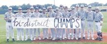 Jacksboro baseball team members pose with their bi-district champ sign and their gold ball trophy for winning the series 2-0 over Early. The Tigers will face Blanco this Friday and Saturday, at Howard Payne University. Photo/Brian Smith