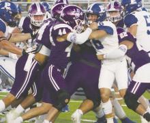 Lucas Cornish (44) and Luis Balderrama wrap up the Peaster ball carrier during the Friday, Sept. 13 homecoming game. Photo/Brian Smith