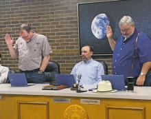 Jacksboro Alderman Joel Hood, left, and Mayor Craig Fenter are sworn in for new terms during the Monday, May 22 city council meeting. Photo/Brian Smith