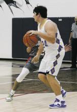 Jacob Hearne looks for an outlet as Bryson played Forestburg at home Tuesday, Dec. 13. Photo/Brian Smith