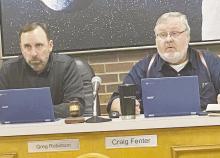 Jacksboro Mayor Craig Fenter, right, asks a question with Alderman Greg Robinson looking on during the city council meeting Monday, Feb. 13. Photo/Brian Smith