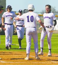 Cannon Valenzuela, right, is welcomed to home plate following a first inning home run in the District 7-3A opener Monday, March 10 against Vernon. The Tigers swept both ends of the doubleheader, 11-1 and 13-1. Photo/Brian Smith