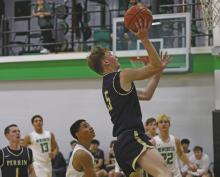 Case Lambert jumps to make a shot at the net during the Perrin match up Friday, Jan. 24 with the Newcastle Bobcats. Photo/Thomas Wallner, The Graham Leader