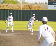 Jacksboro’s Lando Belcher makes the throw to first base as part of the City View game Friday, March 24. The Tigers run ruled the Mustangs, 10-0 in a game played at Iowa Park. Photo/Brian Smith