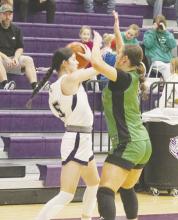 Kennedy Lowther looks for a teammate to pass to in the Tigerettes’ loss to Iowa Park. Jacksboro travels Friday, Jan. 31 to City View. Photo/Brian Smith