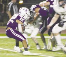 Luis Balderrama (22) looks for a hole Friday, Oct. 25 as Jacksboro faced Henrietta. Balderrama had a pair of second quarter touchdowns in a 60-17 win over the Bearcats. Photo/Brian Smith