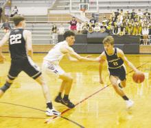 Graford’s Christian Shea (2) looks to drive by Huckabay’s Payton Gill during second quarter action Saturday, March 4 at the Region III-A Tournament in Mansfield. Photo/Brian Smith