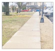 The sidewalk along Archer Street on the north side of the courthouse will be moved south about five feet toward the building to allow for easier access for vehicles along the street later this summer. The work is expected to take place the second half of the year as part of the Downtown Revitalization Grant program. Photos/Brian Smith