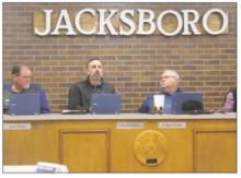 Jacksboro alderman Greg Robinson, center, asks a question with Mayor Craig Fenter, right, and alderman Joel Hood looking on. The council is looking to have more say concerning personnel policies but will do more research before any decision is made. Photo/Brian Smith